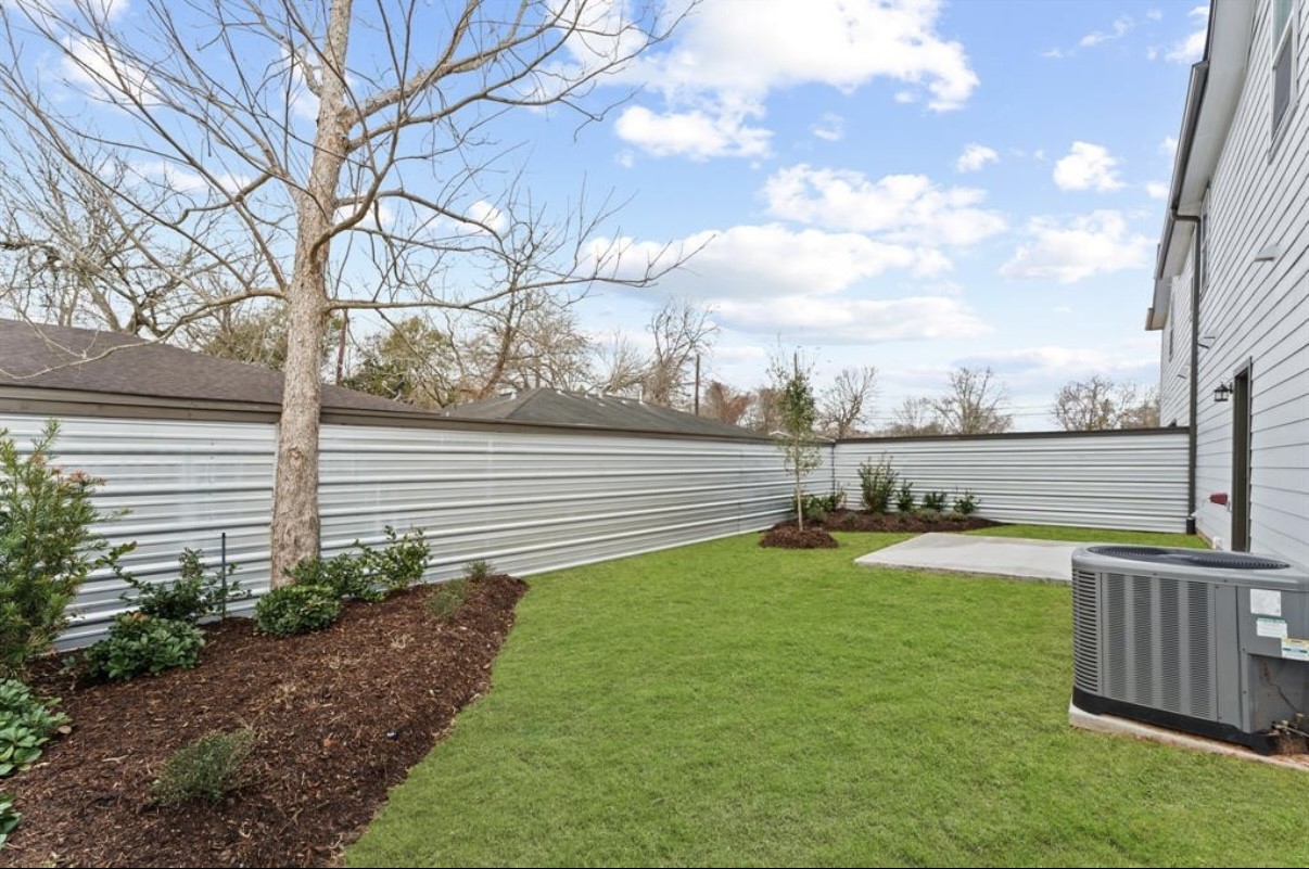 5140 Mallow Street Houston, TX 77033 - Photo 18 of 23 a view of a patio with a yard
