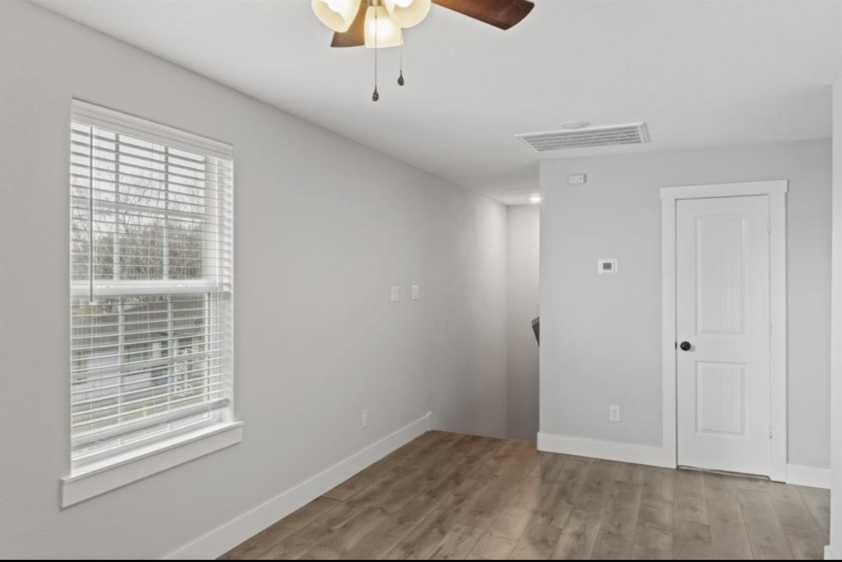 5140 Mallow Street Houston, TX 77033 - Photo 4 of 23 a view of an empty room with a window