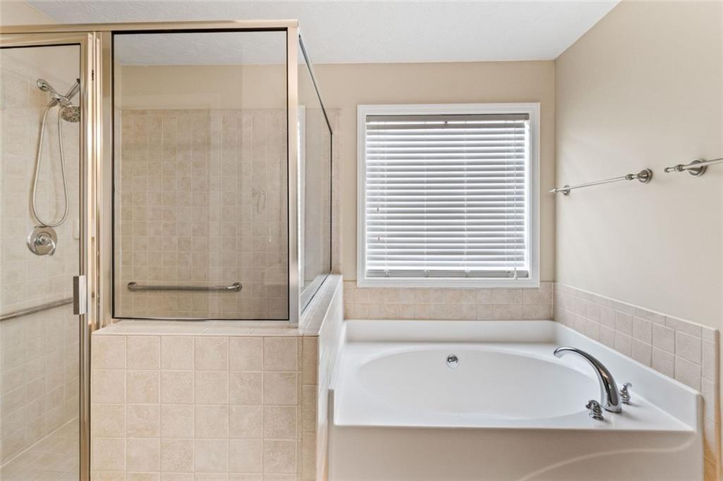 241 Red Bud Road Jefferson, GA 30549 - Photo 28 of 43 a bathroom with a bathtub and shower