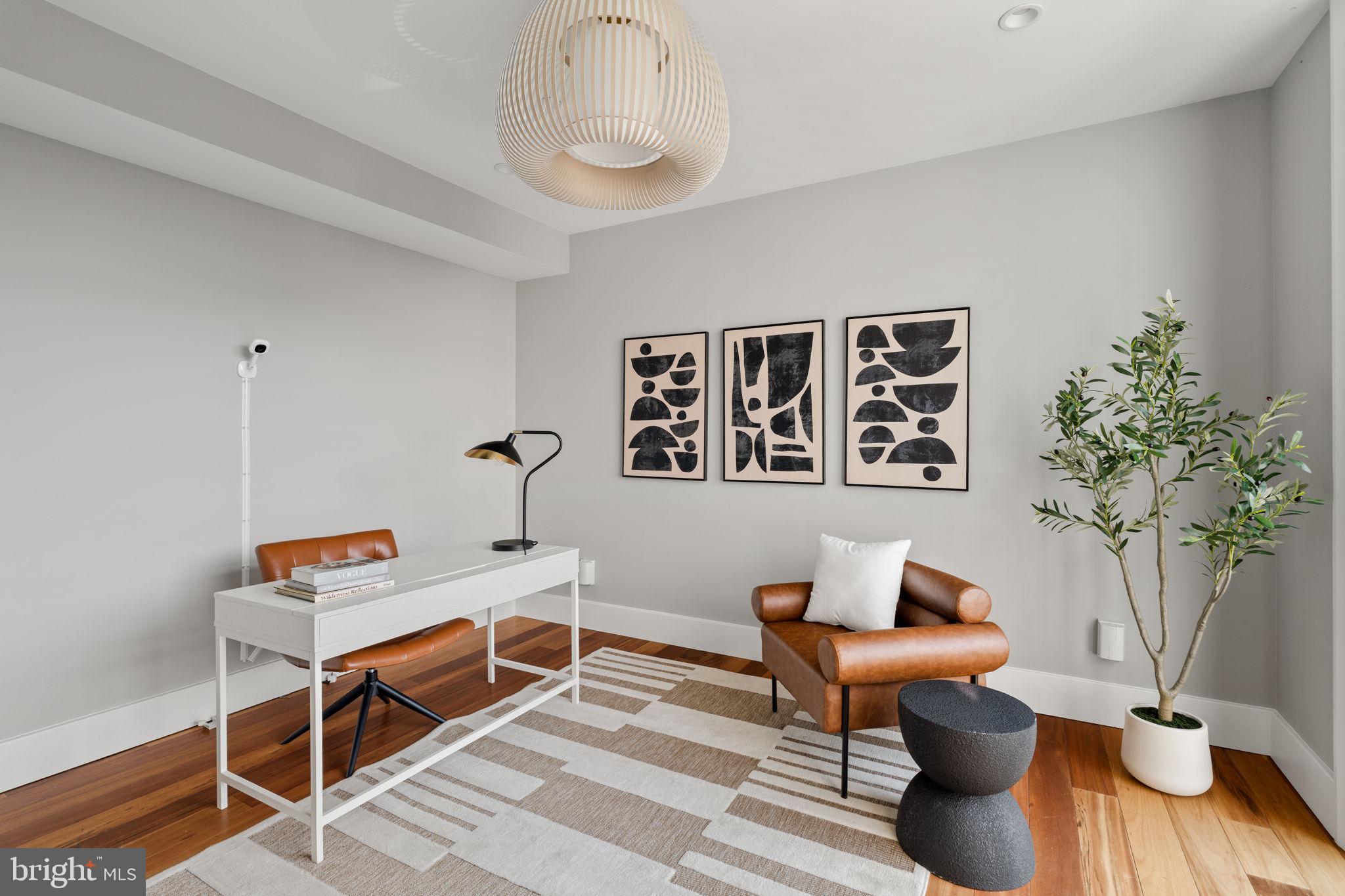 519 Bainbridge Street, Unit A Philadelphia, PA 19147 - Photo 12 of 44 a workspace with furniture and potted plant