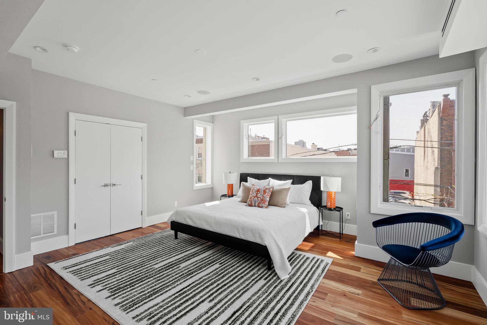 519 Bainbridge Street, Unit A Philadelphia, PA 19147 - Photo 15 of 44 a bedroom with a bed and wooden floor