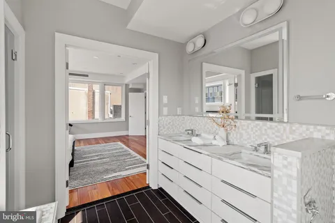 a bathroom with sink and mirror