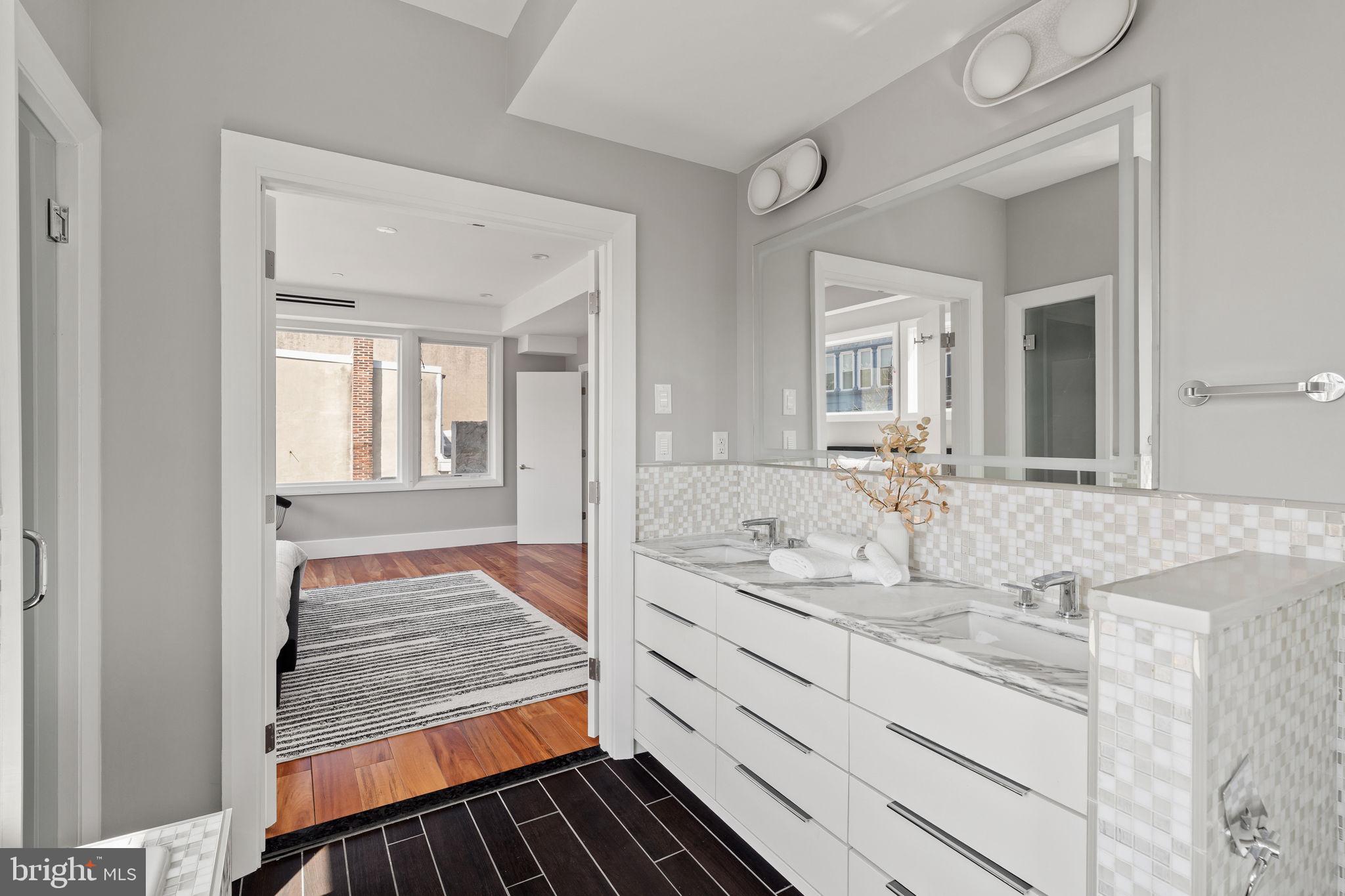 519 Bainbridge Street, Unit A Philadelphia, PA 19147 - Photo 19 of 44 a bathroom with sink and mirror