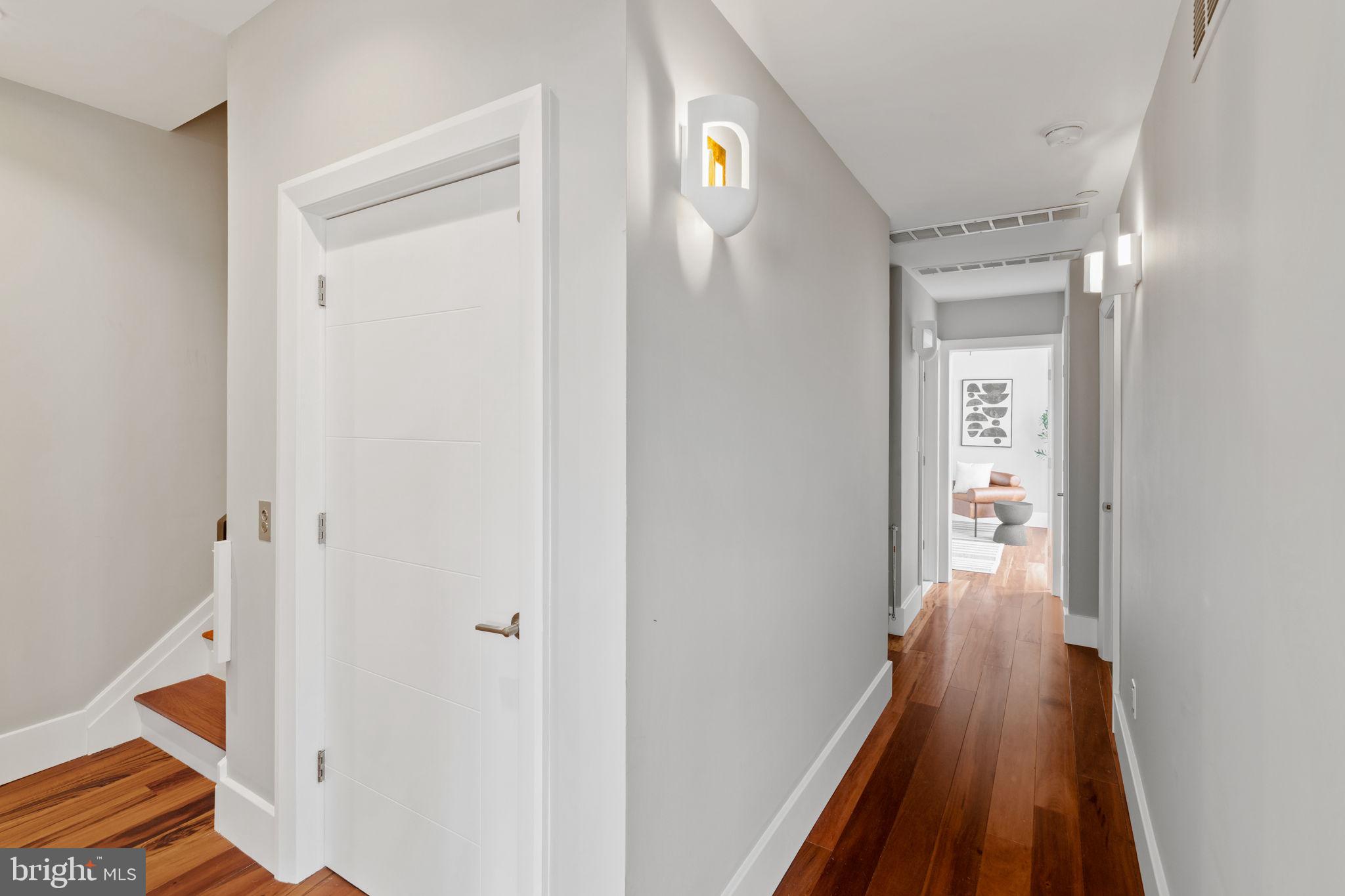 519 Bainbridge Street, Unit A Philadelphia, PA 19147 - Photo 22 of 44 a view of a hallway with wooden floor and staircase
