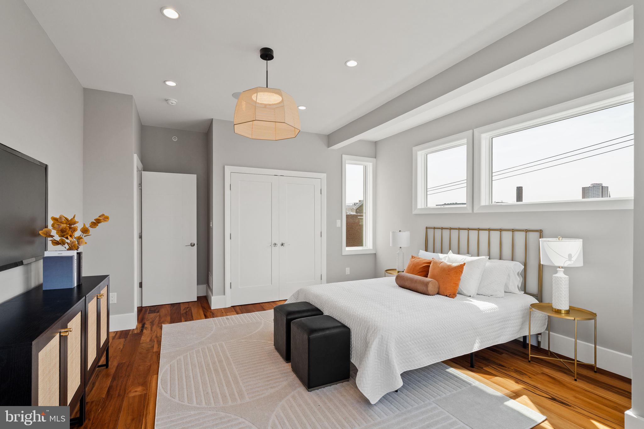 519 Bainbridge Street, Unit A Philadelphia, PA 19147 - Photo 28 of 44 a bedroom with a bed and wooden floor