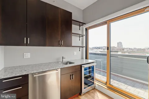 a kitchen with a sink and a window