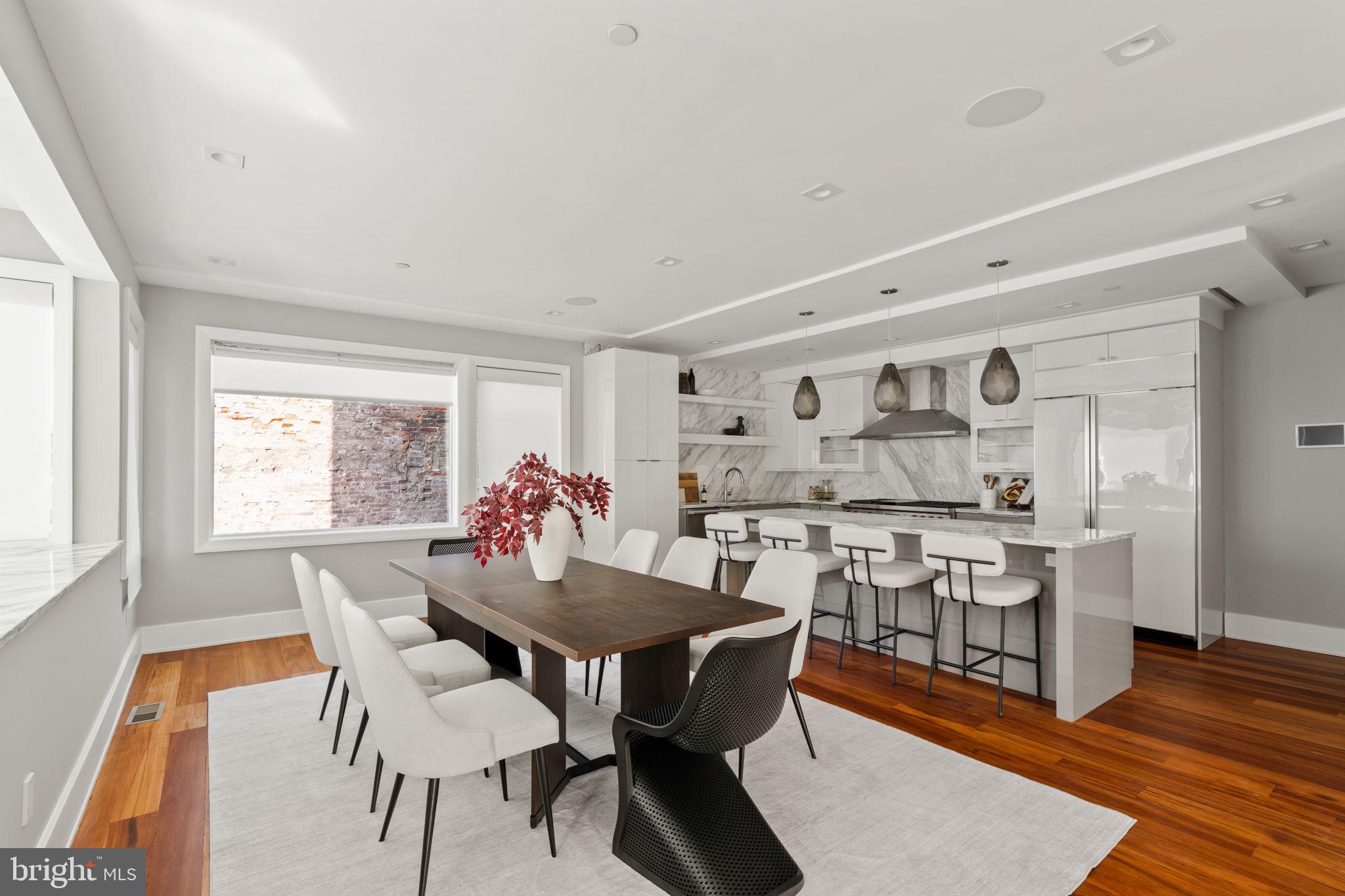 519 Bainbridge Street, Unit A Philadelphia, PA 19147 - Photo 8 of 44 a dining room with furniture and wooden floor