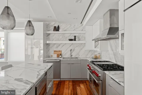 a kitchen with cabinets and appliances