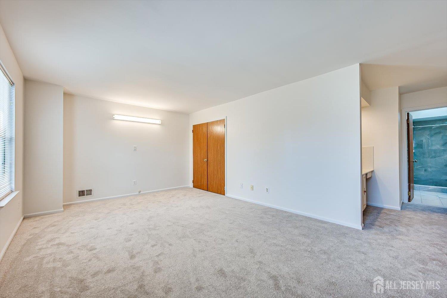 404 Maplecrest Road Edison, NJ 08820 - Photo 17 of 25 an empty room with an entryway