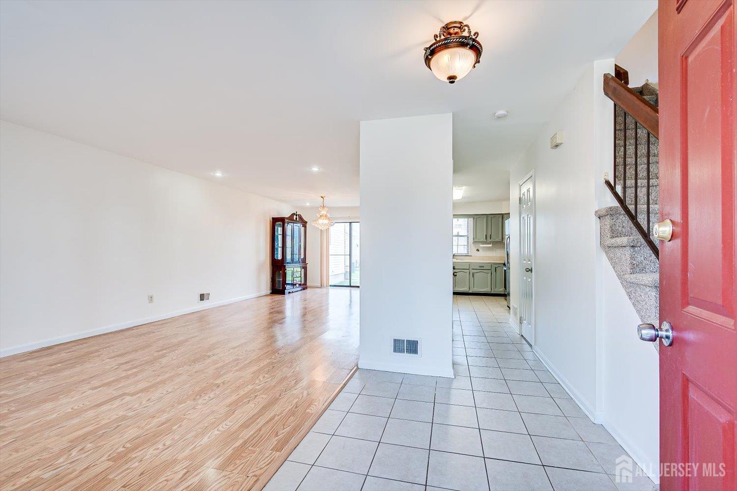 404 Maplecrest Road Edison, NJ 08820 - Photo 5 of 25 wooden floor in an empty room with a window