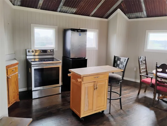 a kitchen with a stove and a refrigerator