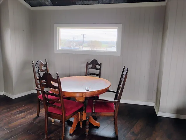 a dining room with furniture and window