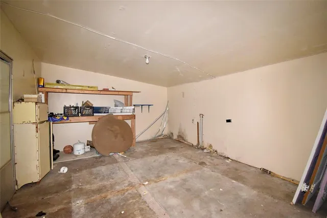 a view of a storage & utility room with two washing machine