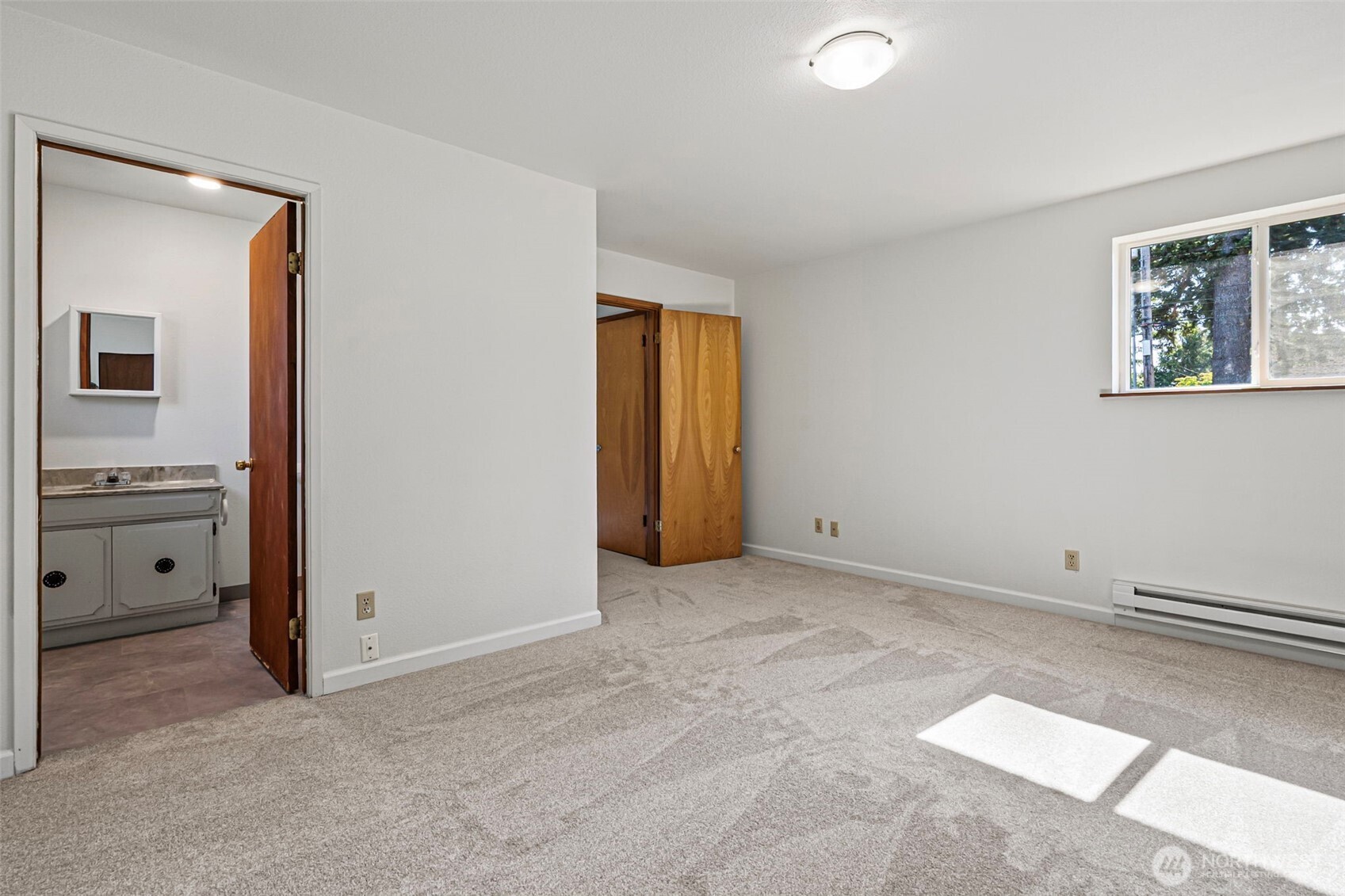 717 Ramsdell Street Fircrest, WA 98466 - Photo 11 of 29 an empty room with windows and cabinet