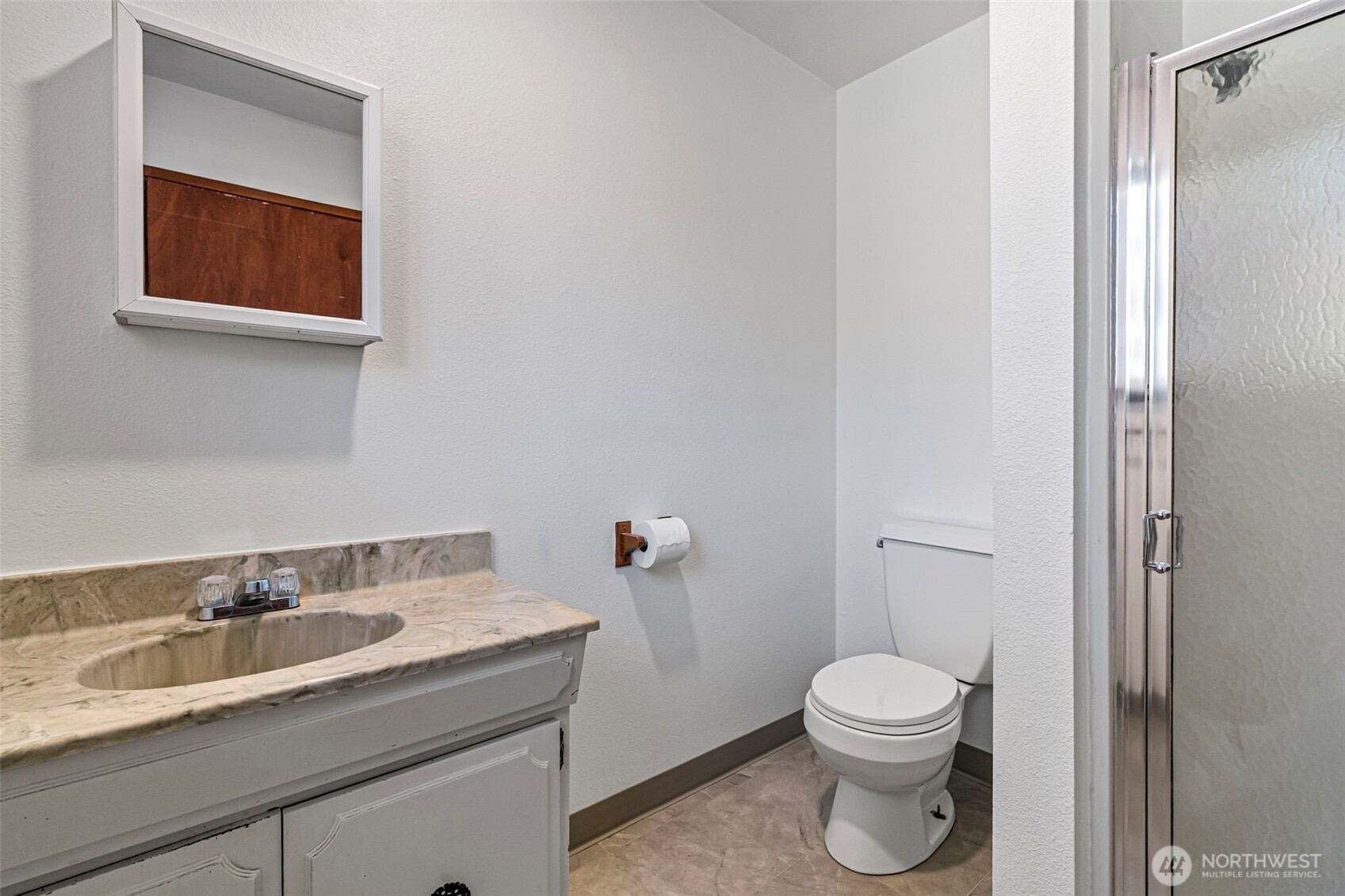 717 Ramsdell Street Fircrest, WA 98466 - Photo 12 of 29 a bathroom with a toilet a sink and mirror