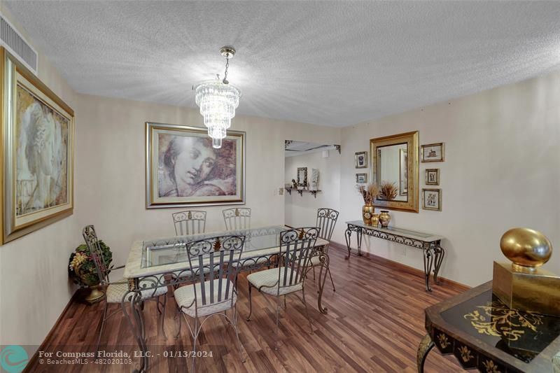 Palm Aire Pompano Beach, FL 33069 - Photo 5 of 12 a view of a dining room with furniture wooden floor and chandelier