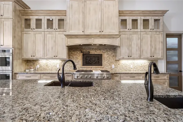 a view of an empty room with window and stairs