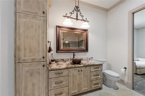 a kitchen with stainless steel appliances granite countertop a stove a refrigerator and a sink