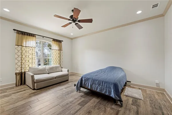 a living room with a fireplace and a flat screen tv