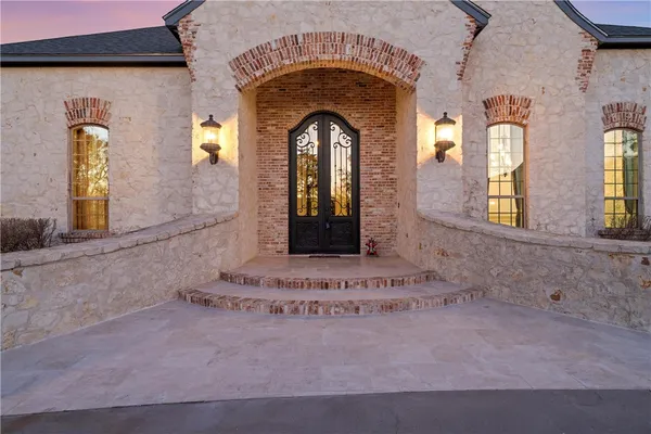 a view of a house with swimming pool in front of residential house with outdoor seating