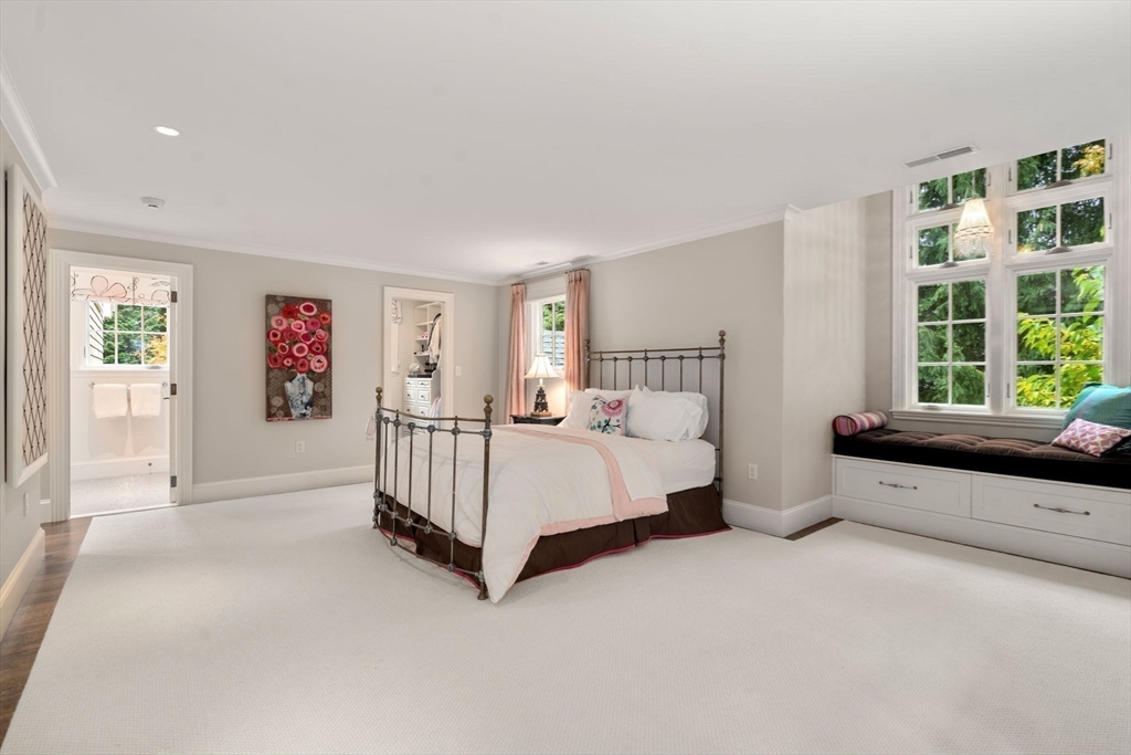 14 Greylock Road Wellesley, MA 02481 - Photo 14 of 24 a spacious bedroom with a bed and a large window