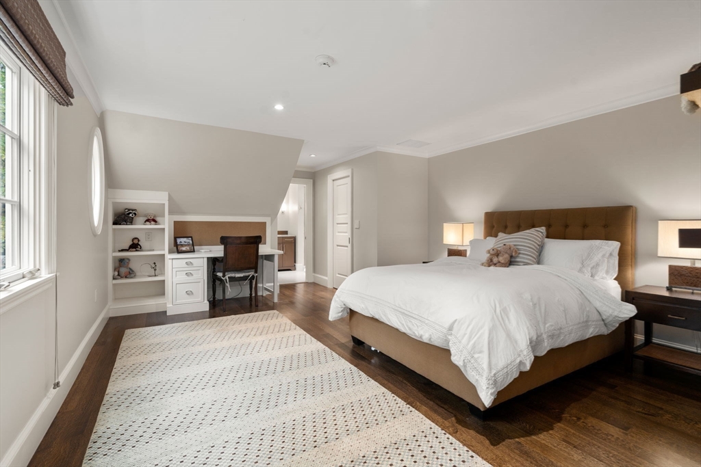 14 Greylock Road Wellesley, MA 02481 - Photo 15 of 24 a bedroom with a bed and dresser with wooden floor