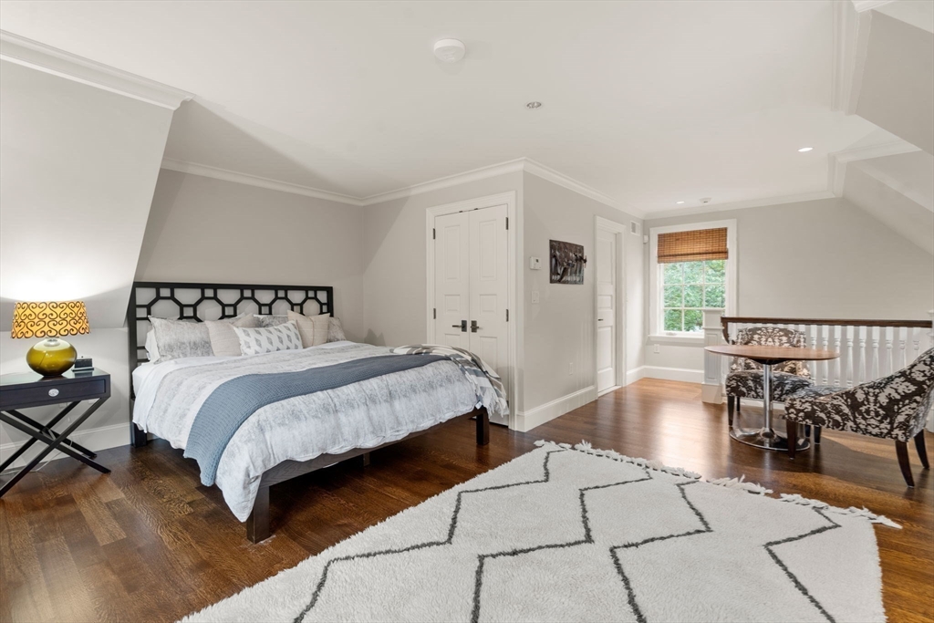 14 Greylock Road Wellesley, MA 02481 - Photo 18 of 24 a bedroom with a bed and lamp