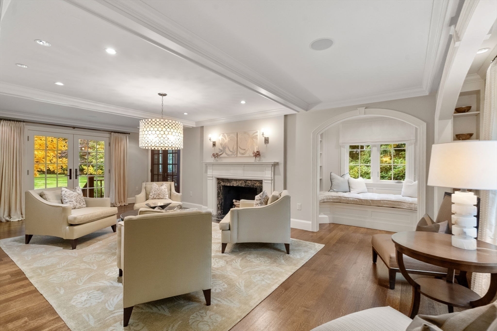 14 Greylock Road Wellesley, MA 02481 - Photo 3 of 24 a living room with furniture a fireplace and a large window