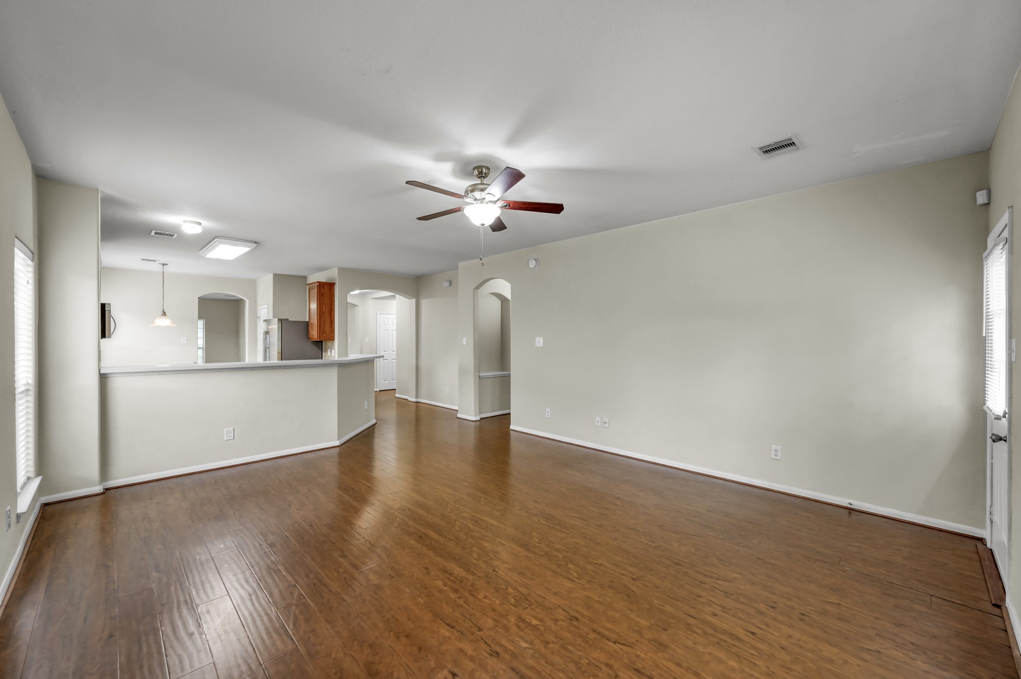 631 Timberstand Lane Spring, TX 77373 - Photo 12 of 38 Beautiful upgraded laminate flooring continues throughout the main living spaces, offering style and easy maintenance with no carpet.