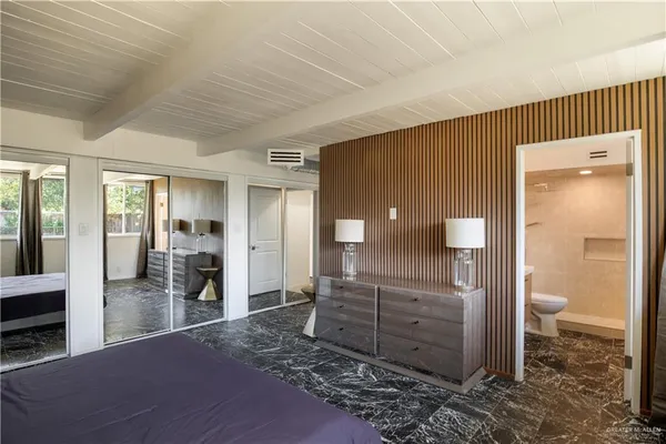 a spacious bathroom with a shower and a sink