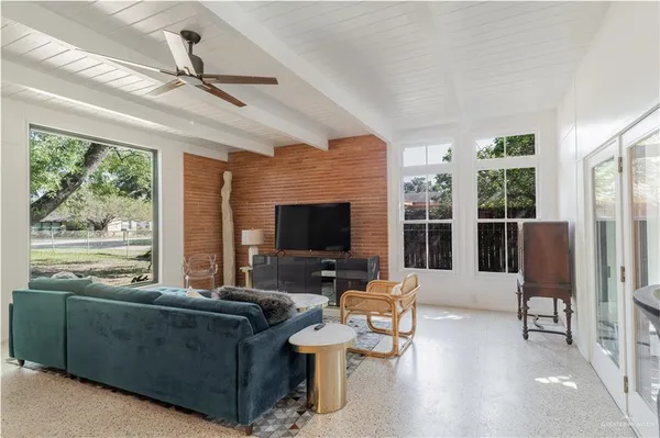 a living room with furniture and a flat screen tv