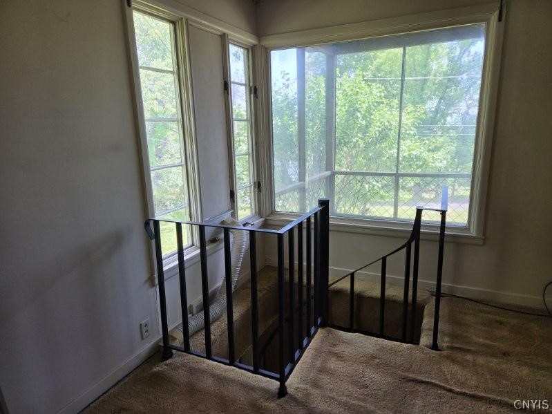 4581 Broad Road Onondaga, NY 13215 - Photo 22 of 29 Spiral Staircase from Livingroom to lower level