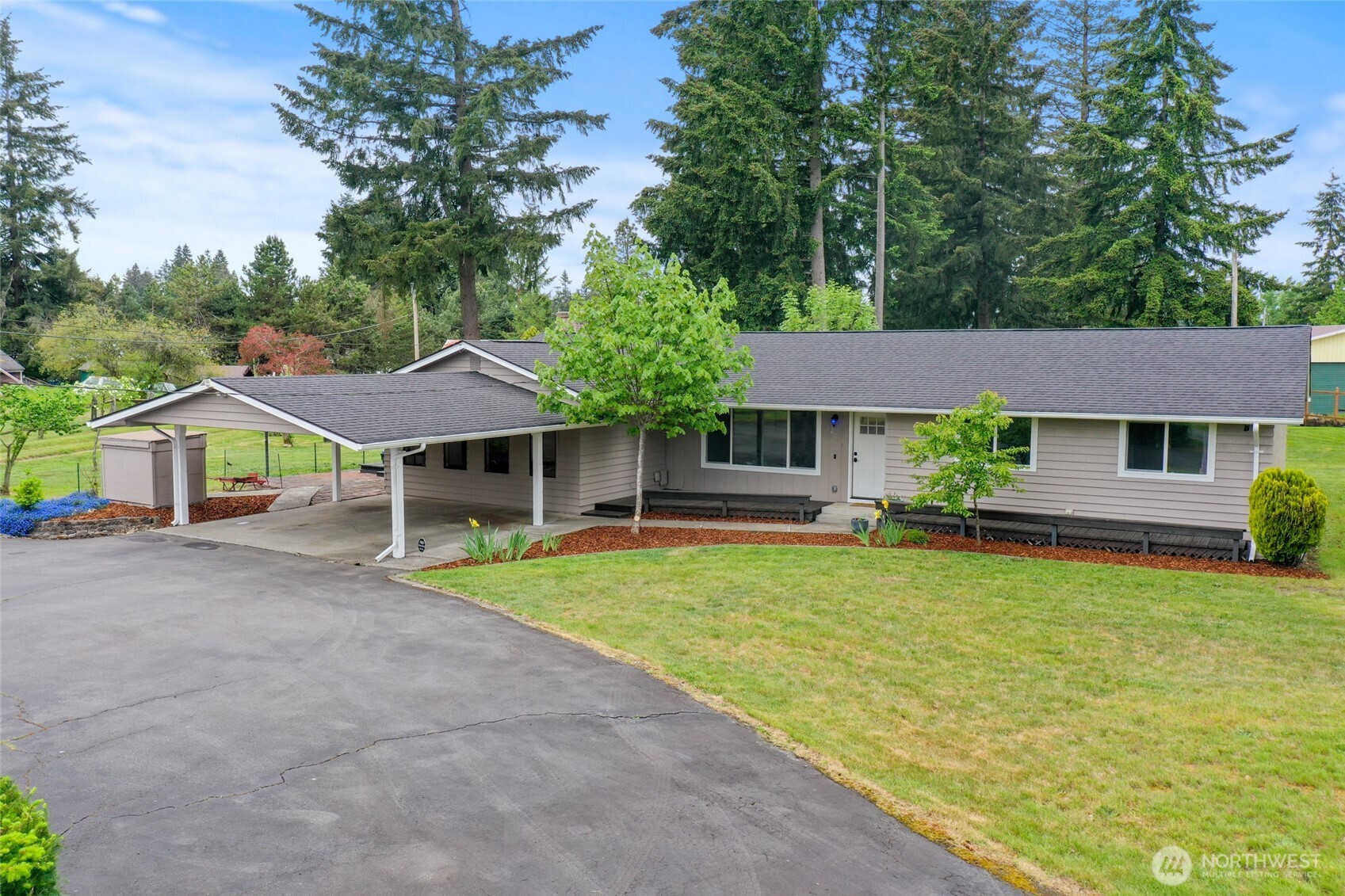 19045 Nutmeg Street Southwest Rochester, WA 98579 - Photo 1 of 1 a front view of a house with garden
