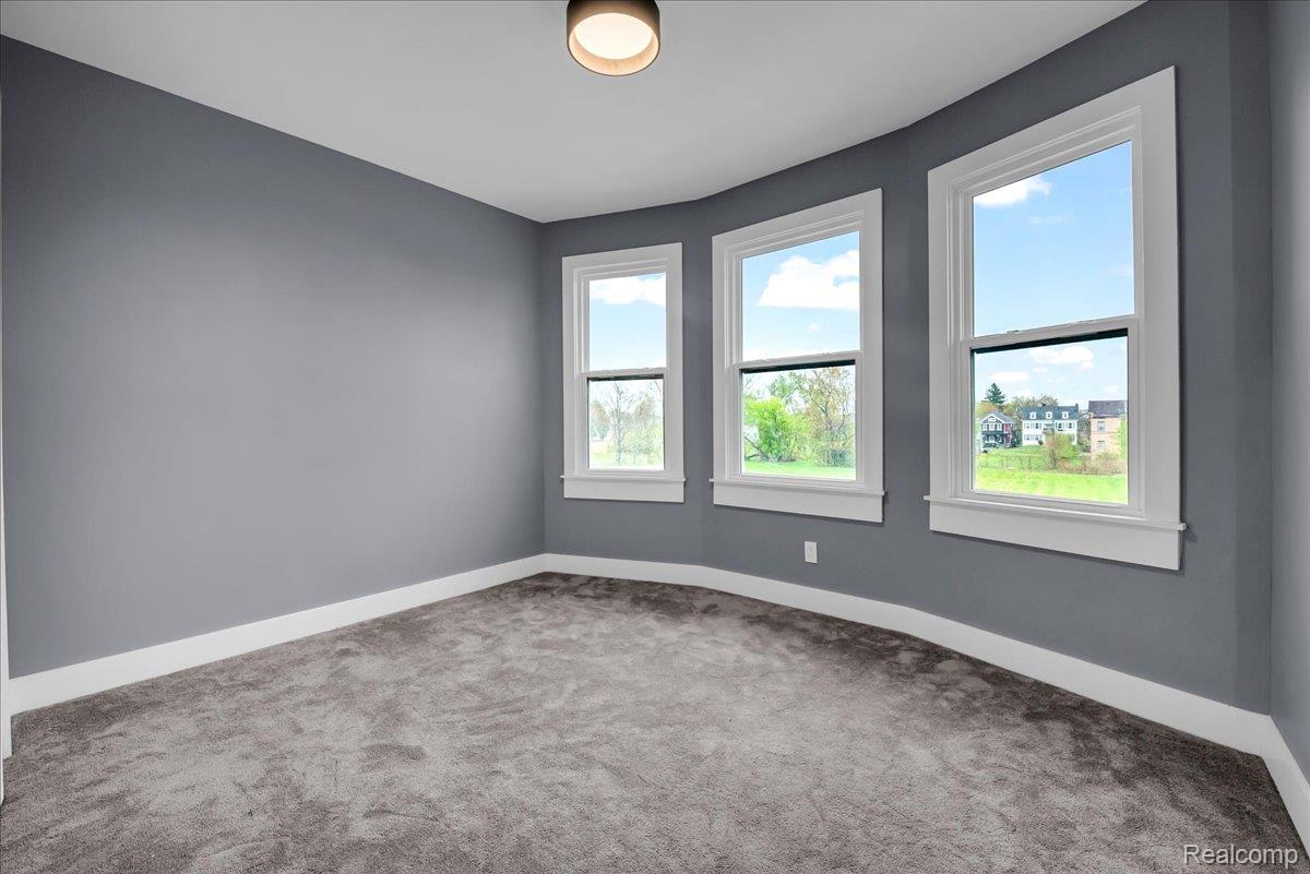 2181 Harding Street Detroit, MI 48214 - Photo 17 of 32 Carpeted empty room with baseboards