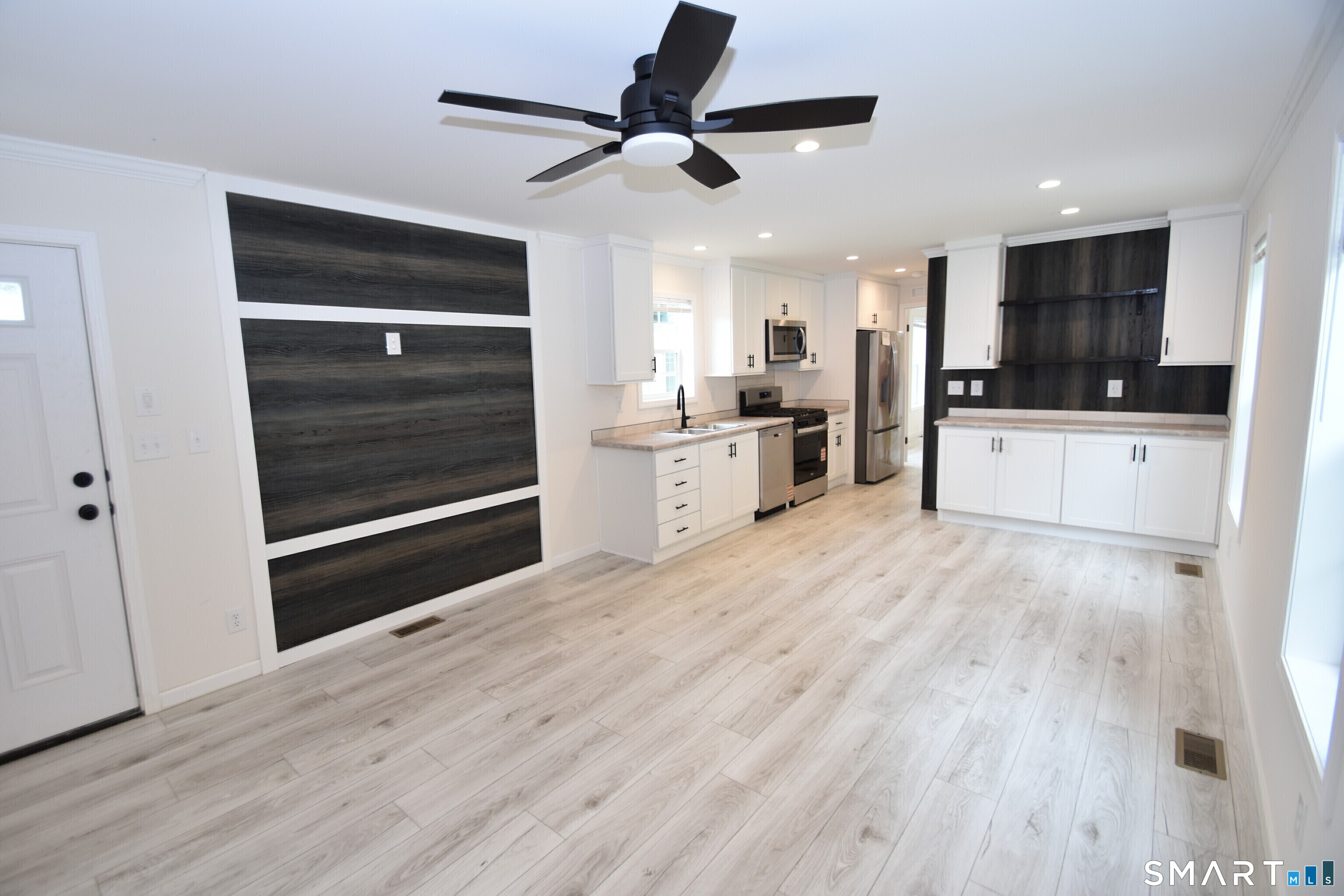 166 Boston Turnpike, Unit F Bolton, CT 06043 - Photo 2 of 13 Living Room into Kitchen & Eating Area