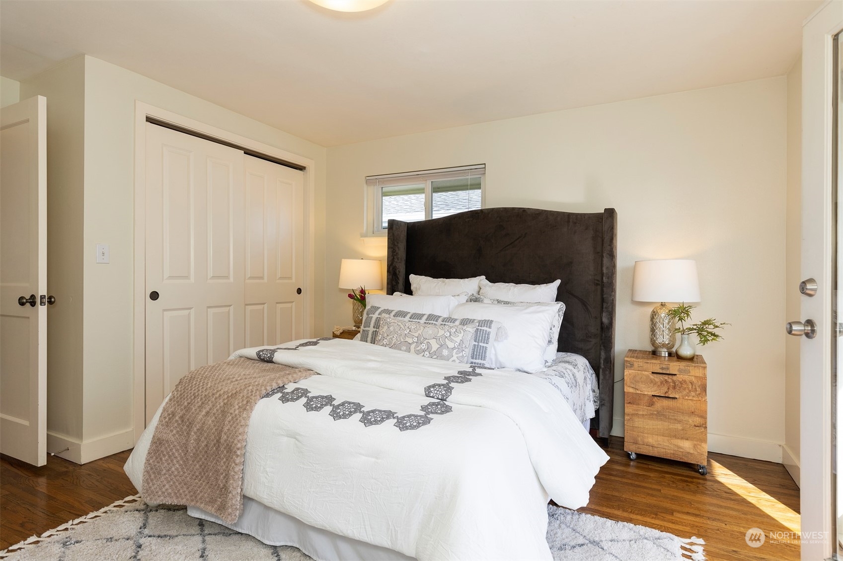 1505 35th Avenue South Seattle, WA 98144 - Photo 16 of 39 a large bed sitting in a bedroom next to a cabinet