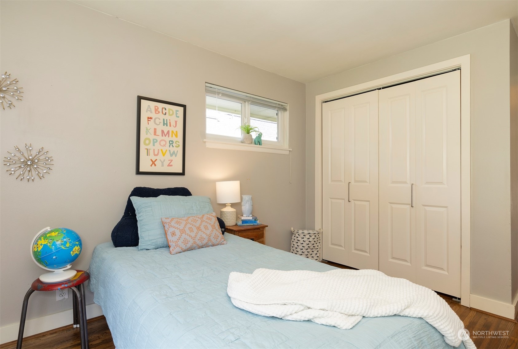 1505 35th Avenue South Seattle, WA 98144 - Photo 20 of 39 a bedroom with a bed and painting on the wall