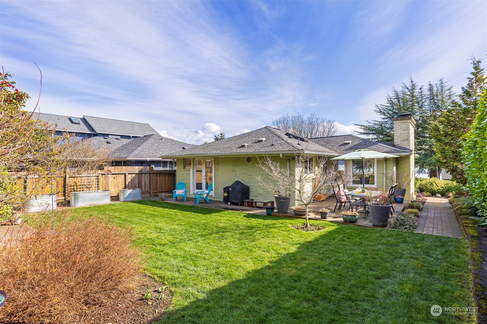 1505 35th Avenue South Seattle, WA 98144 - Photo 2 of 39 a view of a big house with table and chairs under an umbrella