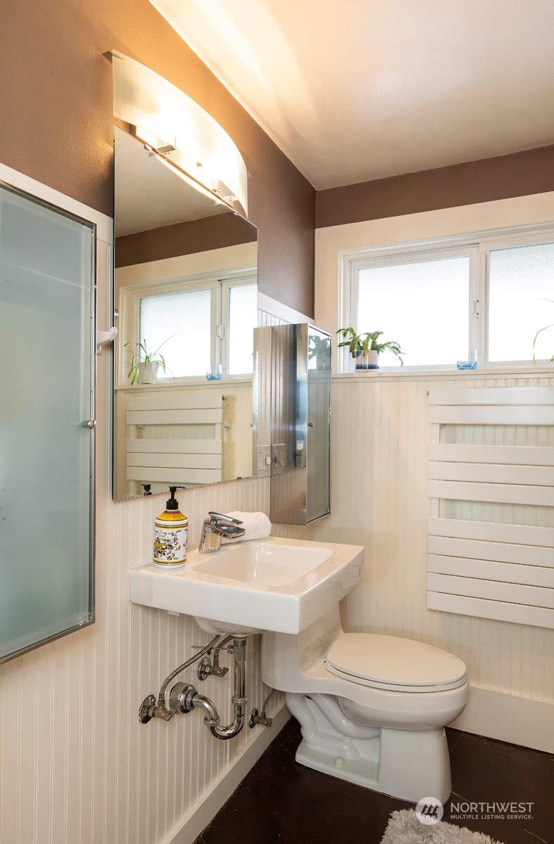 1505 35th Avenue South Seattle, WA 98144 - Photo 22 of 39 a bathroom with a sink toilet and window