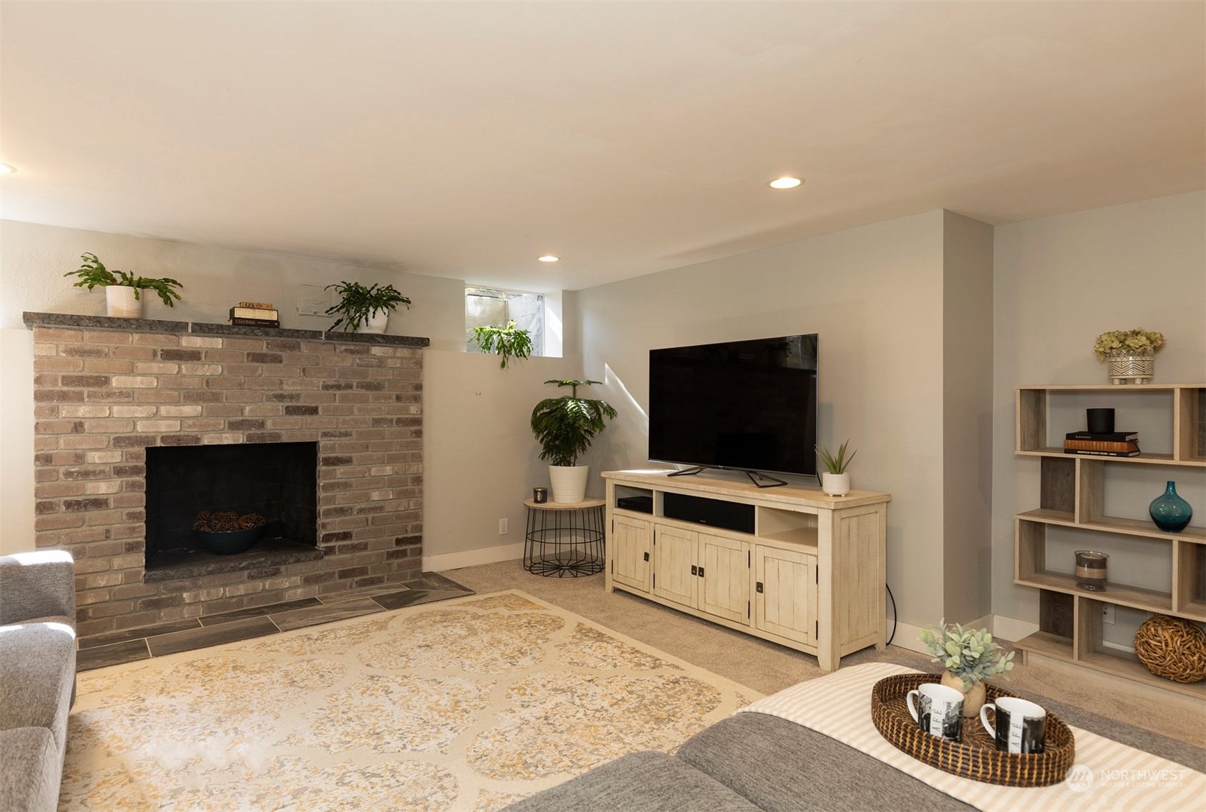 1505 35th Avenue South Seattle, WA 98144 - Photo 25 of 39 a living room with furniture and a flat screen tv