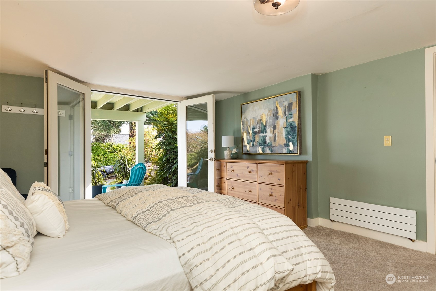 1505 35th Avenue South Seattle, WA 98144 - Photo 27 of 39 a bedroom with a large window and a bed