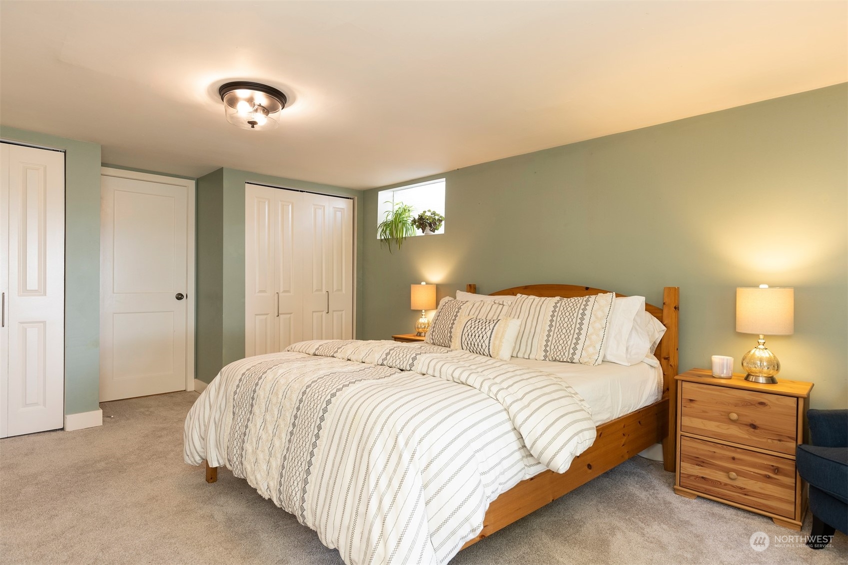 1505 35th Avenue South Seattle, WA 98144 - Photo 28 of 39 a bedroom with a bed and a night stand