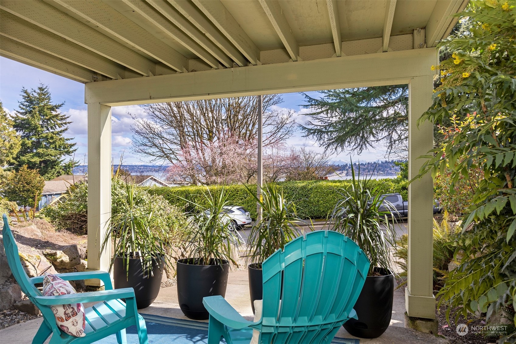 1505 35th Avenue South Seattle, WA 98144 - Photo 30 of 39 a vase of flowers sitting on a table with potted plants