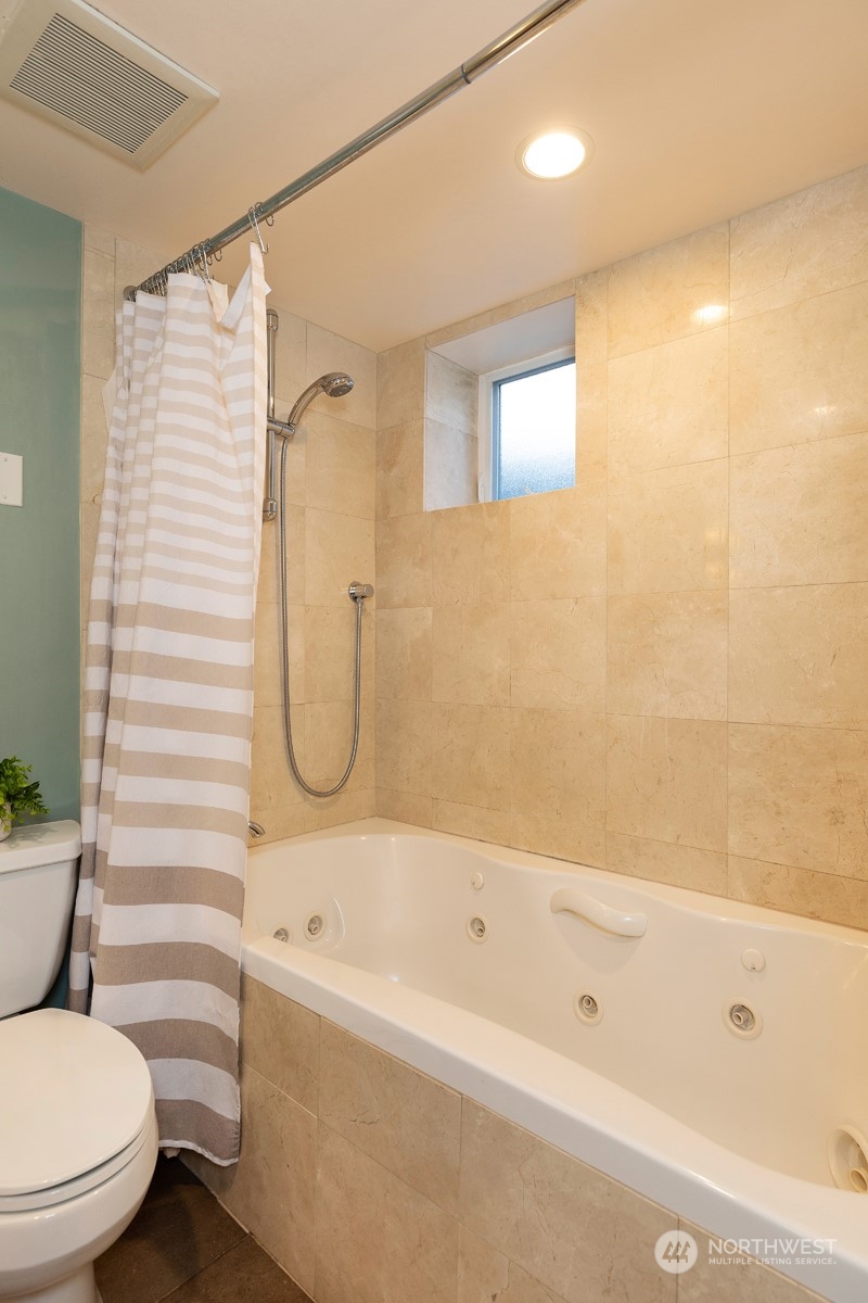 1505 35th Avenue South Seattle, WA 98144 - Photo 31 of 39 a bathroom with a toilet and a bathtub