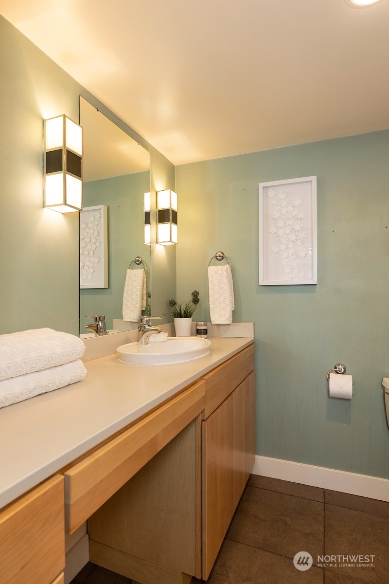 1505 35th Avenue South Seattle, WA 98144 - Photo 32 of 39 a en suite bathroom with a sink and mirror