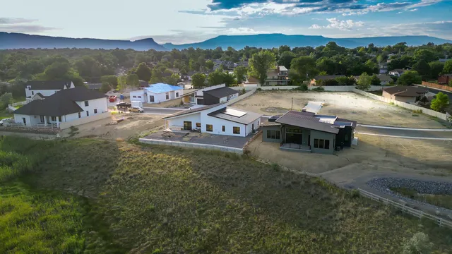 a view of a lake with couches and city view