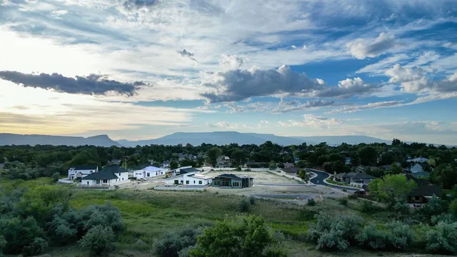 a view of a swimming pool with a yard