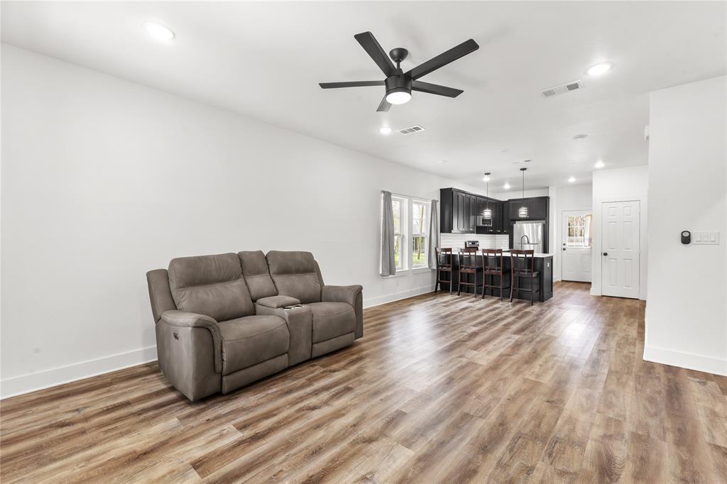 101 Ross Street Sulphur Springs, TX 75482 - Photo 3 of 30 Living area featuring ceiling fan, light wood-type flooring, and recessed lighting