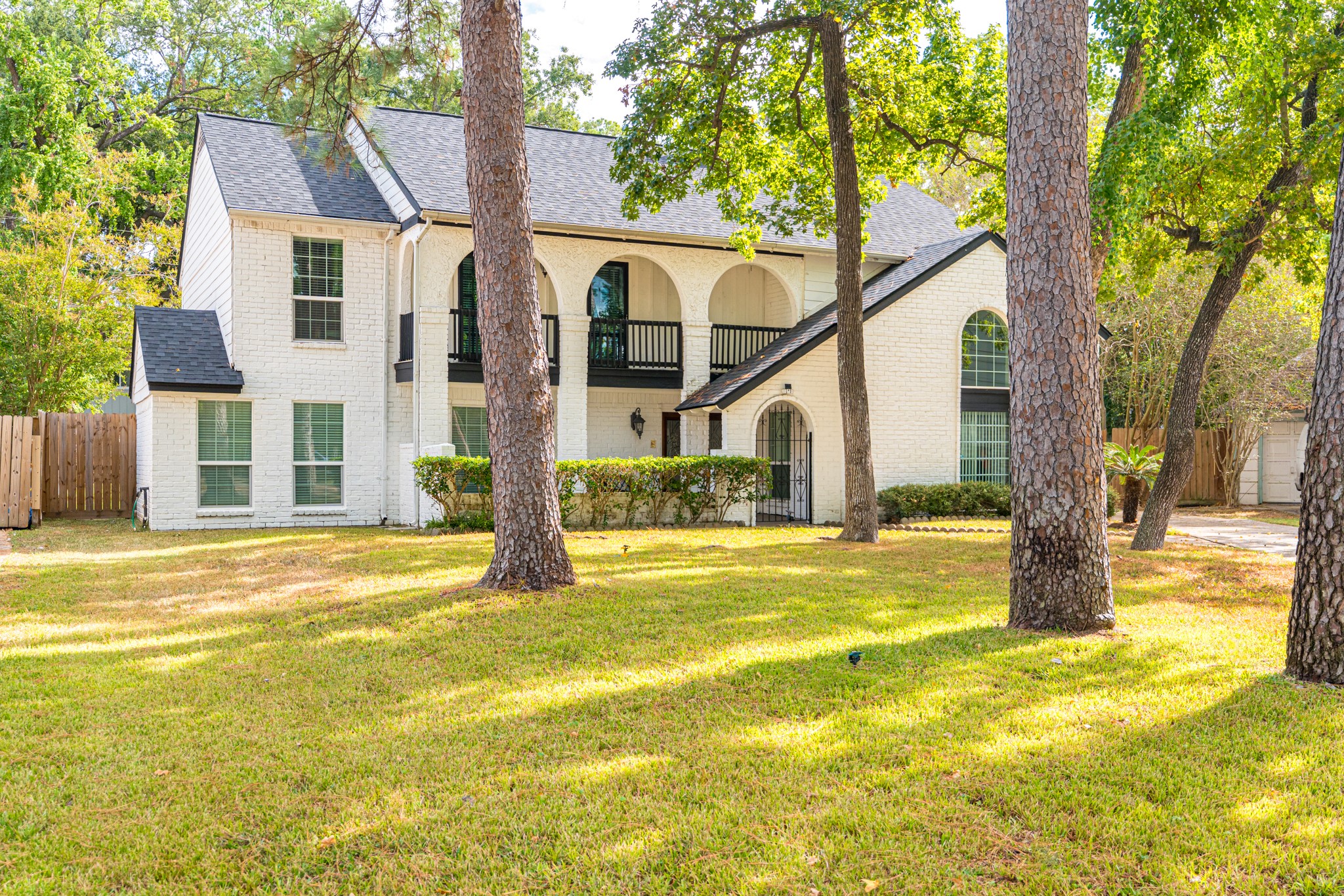 16902 Summit Oaks Lane Spring, TX 77379 - Photo 1 of 49 a view of a house with a swimming pool