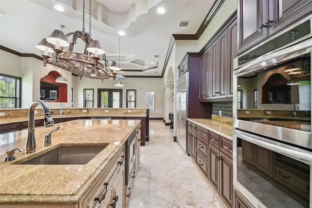 a utility room with sink dryer and washer